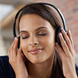 Lady wearing headphones smiling