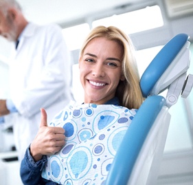 Woman smiling during dental checkup and teeth cleaning visit