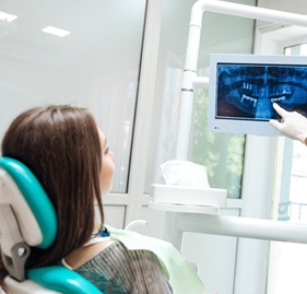 Dentist explaining X-ray to patient