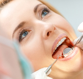 Woman undergoing dental checkup
