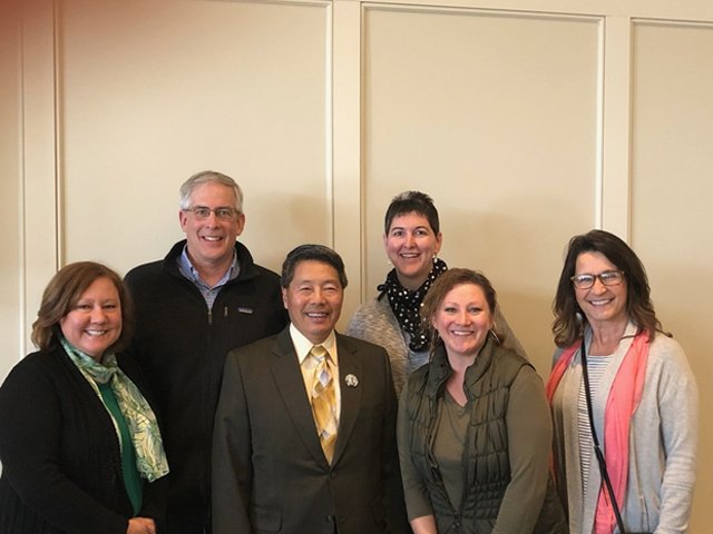 Dentist and dental team members at dentistry presentation
