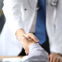 Denture dentist in Montgomery shaking hands with a patient