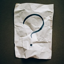 Question mark on wrinkled paper