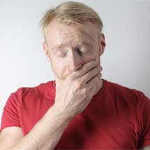 Man in pain needing an emergency dentist