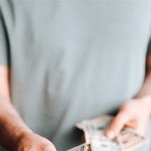 Man holding cash for payment