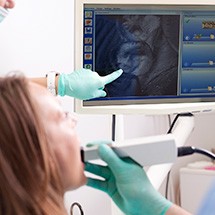 Woman and dentist looking at digital impressions