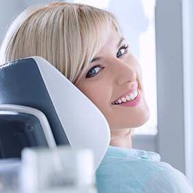 Woman smiling during preventive dentistry visit