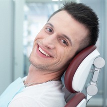 Dental patient smiling after dental treatment with iTero intraoral scanner