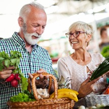 older couple shopping for healthy food 