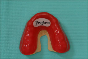 Proform mouthguard lying on table