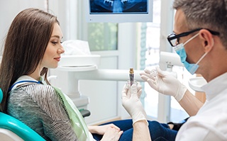 Dentist talking to patient about restorative dentistry options