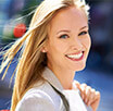 Blonde Lady holding bad smiling