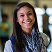 Lady with scarf smiling brightly