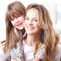 Mother and daughter smiling