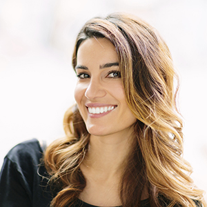 Woman with flawless smile after cosmetic dentistry