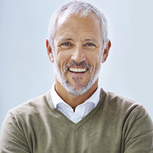 Man with perfected smile after cosmetic dental bonding