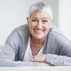 Woman smiling after receiving restorative dentistry