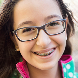 Teen with braces orthodontics smiling