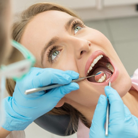 Relaxed dental patient receiving wisdom tooth extraction