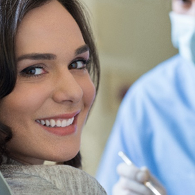 Woman smiling after wisdom tooth extraction