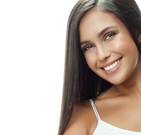 Woman sharing bright smile after teeth whitening
