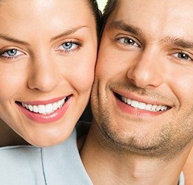 Smiling young couple after teeth whitening